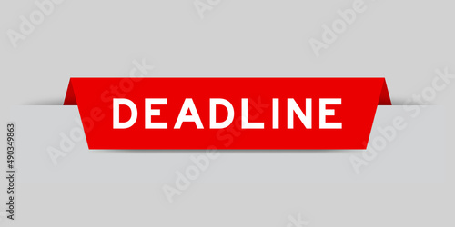 Red color inserted label with word deadline on gray background