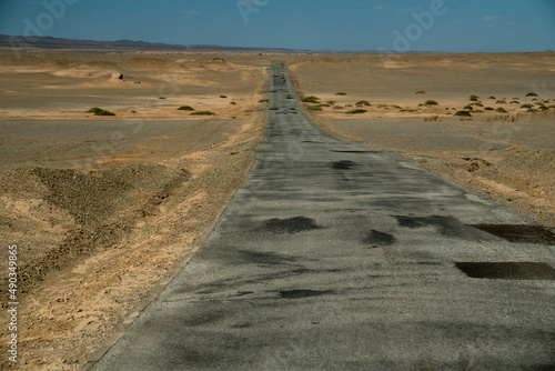 The road in the desert. in Dunhuang Yardang National Geopark, Gansu China. photo