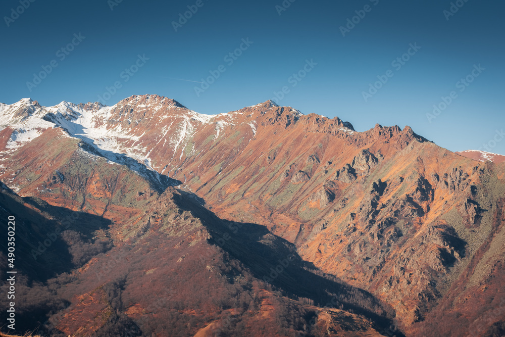 Snowy landscape of the red Piedmont Mountains,  Italian Alps