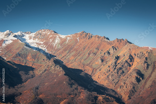 Snowy landscape of the red Piedmont Mountains, Italian Alps