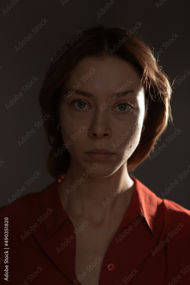 Fashion portrait of a beautiful girl in the studio without makeup Fashion portrait of a beautiful girl in the studio without makeup