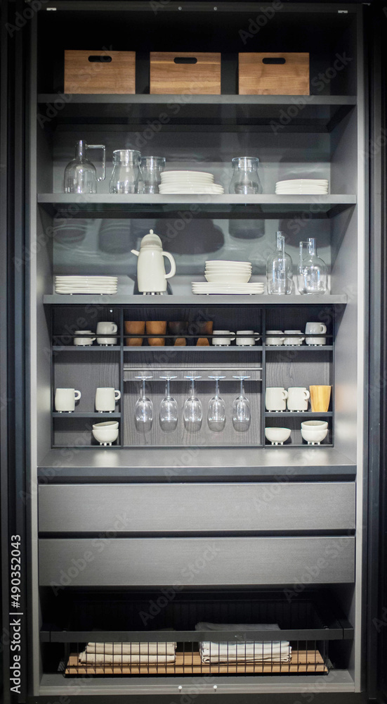 storage of dishes and seasonings in a modern kitchen