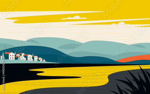 Elegant cityscape of small and cute city on a background of mountains gentle slopes at sunset