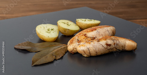 Canvastavla Plate of fried hake roe accompanied by boiled potatoes with olive oil and parsle