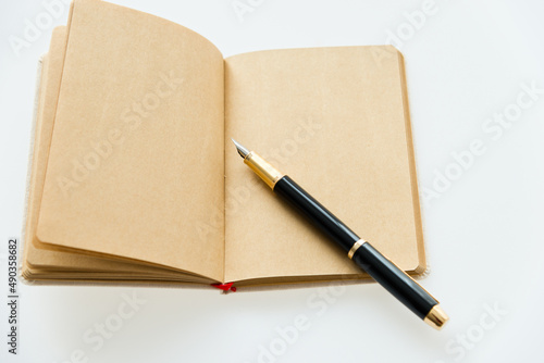 Wallpaper Mural Blank organizer book and pen on table. Torontodigital.ca