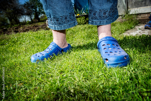 Slippers in green grass during summer
