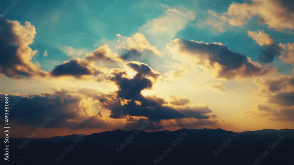 Sublime sunshine is falling through an immense cloud. Panoramic view of a night or solitude and the cessation of the day Sublime sunshine is falling through an immense cloud. Panoramic view of a night or solitude and the cessation of the day