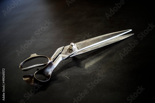Old scissors on a black background