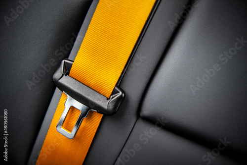 Orange seatbelt in a car