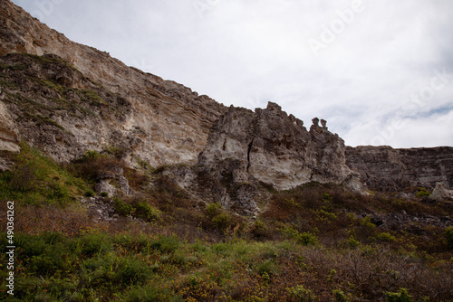 Stone mountains. Geological research near the sea. Natural background. Summer landscape.