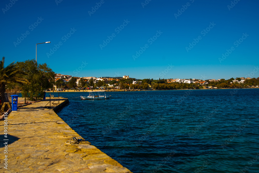 DATCA, TURKEY: View from the promenade on buildings and the sea in the city of Datca on a sunny day.
