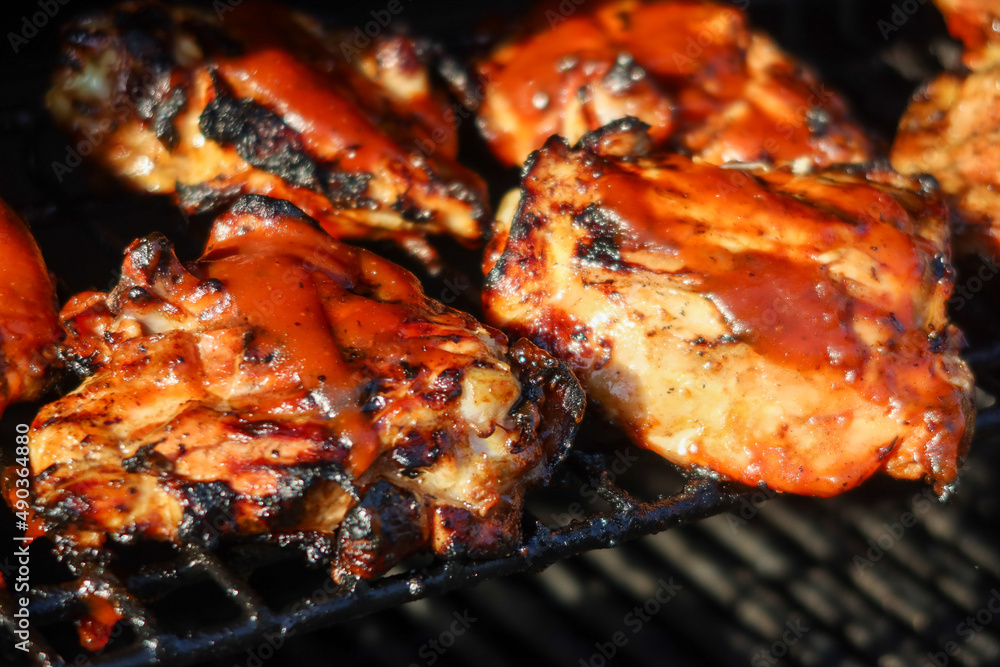 Delicious Barbecued Chicken on a Grill Roasting to Tenderness