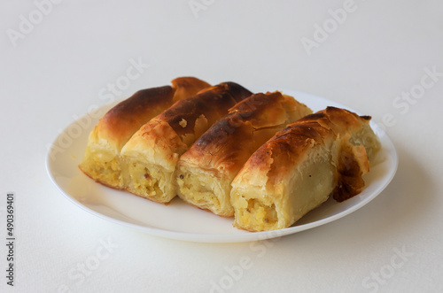 Turkish style potato pie in the form of a roll, made by wrapping dough.