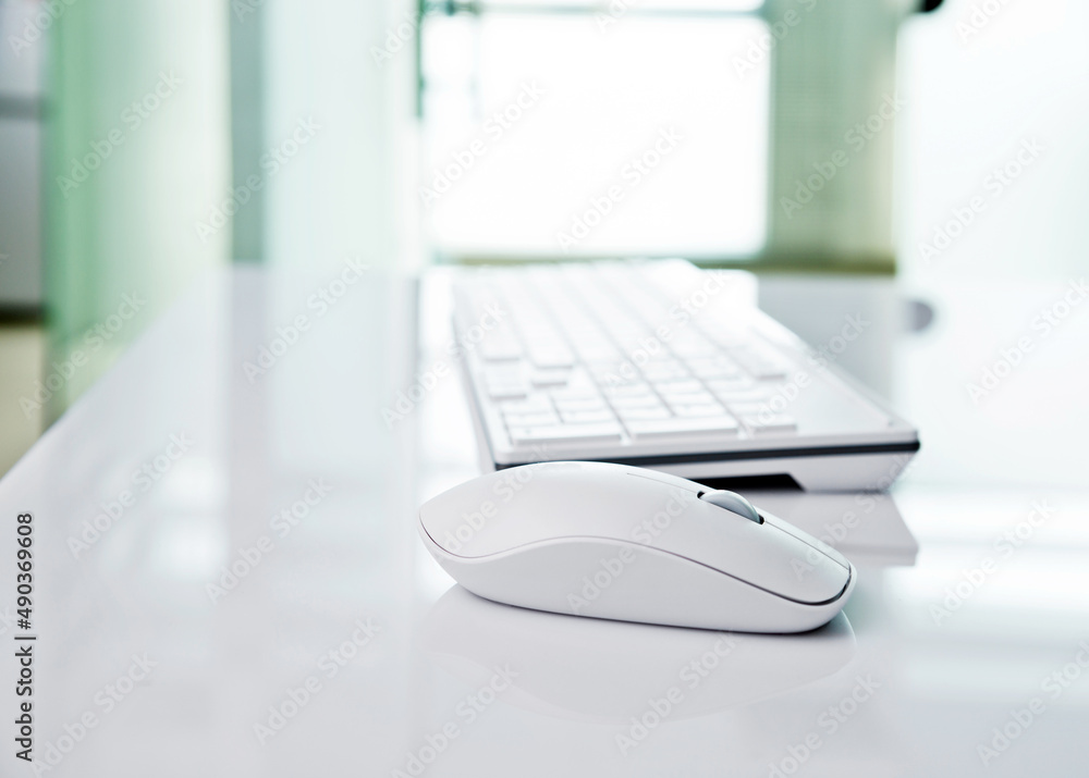 The modern keyboard and the mouse on white table The modern keyboard and the mouse on white table