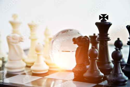 Canvas Print Glass globe on chess board