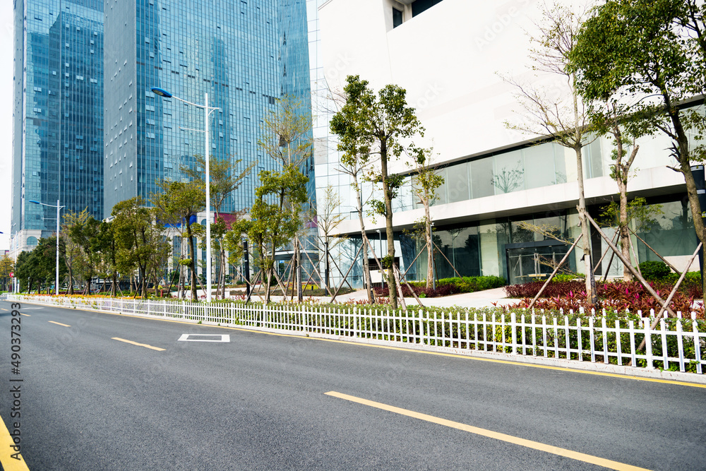 Fototapeta premium Asphalt road and modern building in city