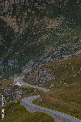 Empty paved mountain road winding through the landscape.