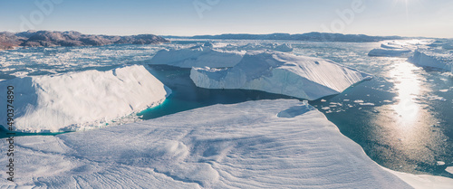 icebergs floating on the sea from aerial point o f view in panoramic