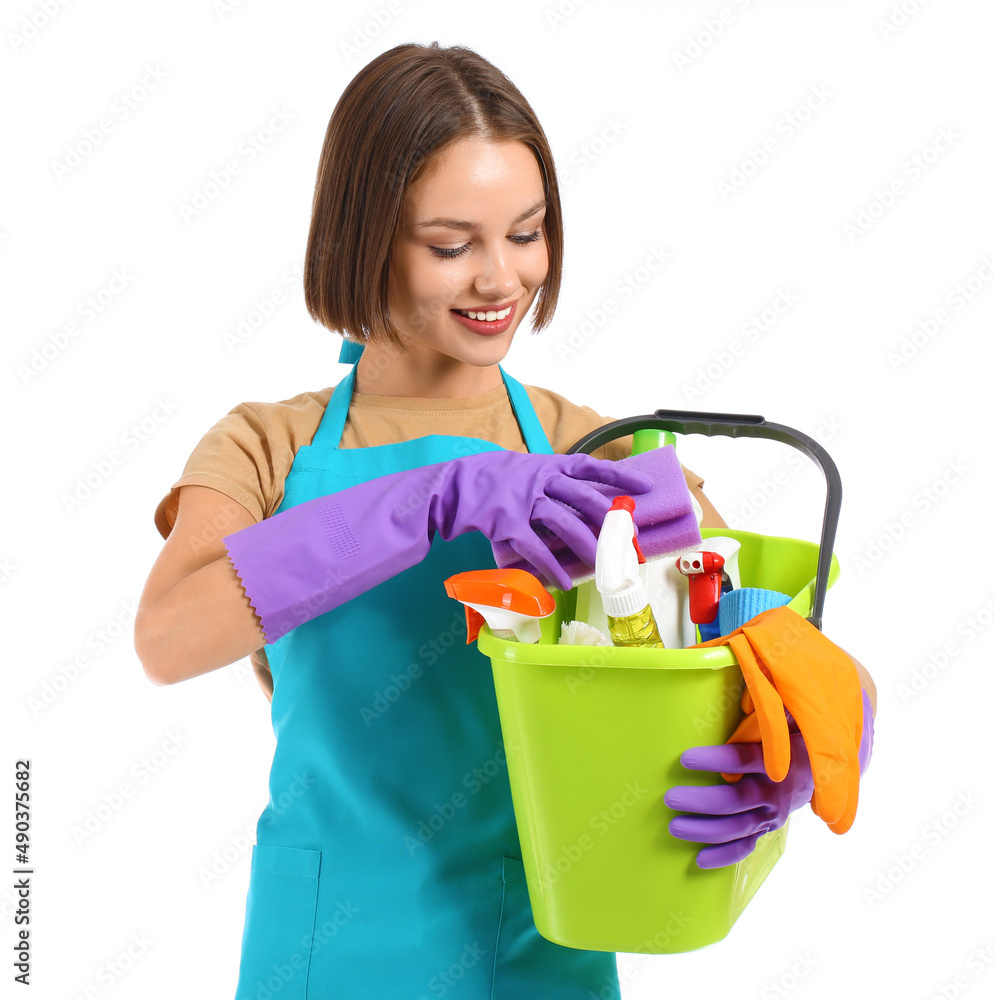 Beautiful young woman with cleaning supplies on white background Beautiful young woman with cleaning supplies on white background