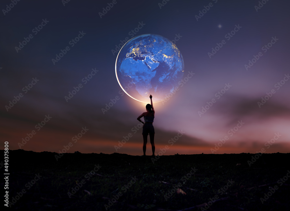 Earth in girl's hands. World Day. Energy saving, world peace,
Girl Power. Elements of this image furnished by NASA.