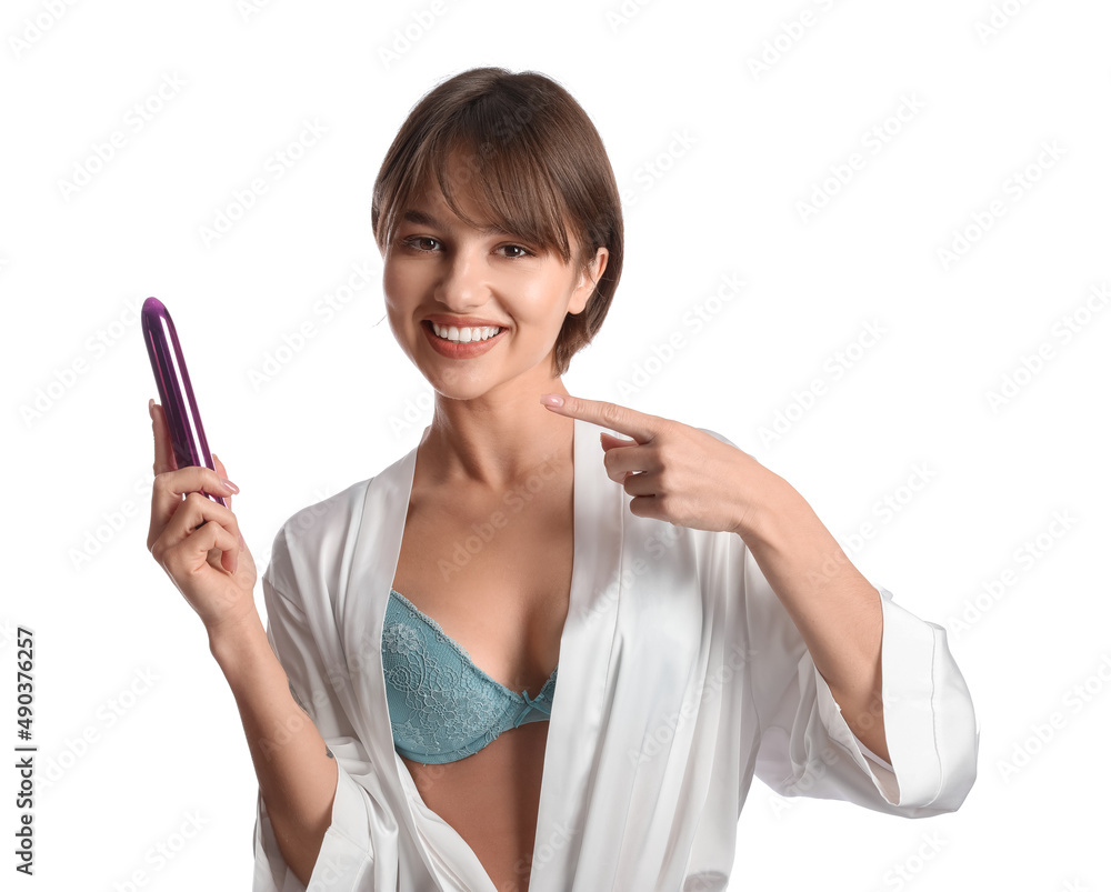 Beautiful young woman with vibrator from sex shop on white background Beautiful young woman with vibrator from sex shop on white background