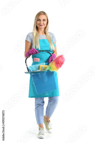 Woman with cleaning supplies isolated on white