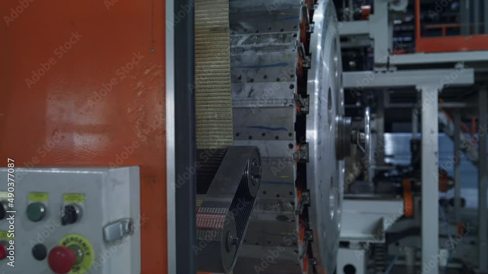 Robotic tyre production equipment working at modern automotive warehouse closeup Robotic tyre production equipment working at modern automotive warehouse closeup