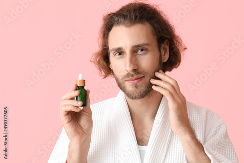 Young man with cosmetic ser...