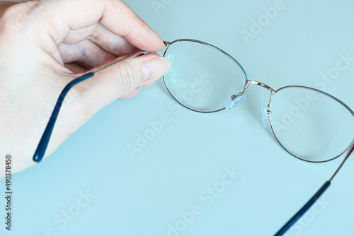Glasses in female hands, copy space template, banner.