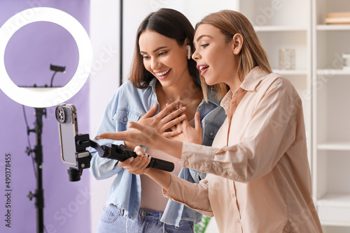 Young female bloggers recor...