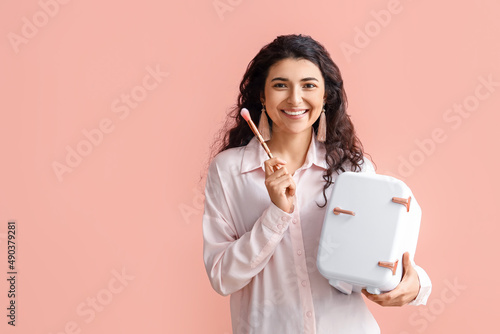 Young woman with small cosm...