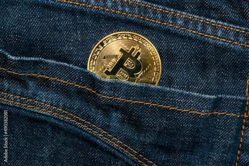 Wallpaper Mural Bitcoin gold coin in jeans pocket investment concept Torontodigital.ca