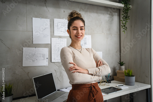 Vászonkép One confident woman female entrepreneur or student standing in front of the desk