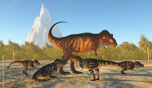 Fototapeta Naklejka Na Ścianę i Meble -  Tyrannosaurus Mother - The young of Tyrannosaurus rex surround their mother during the Cretaceous Period of North America.