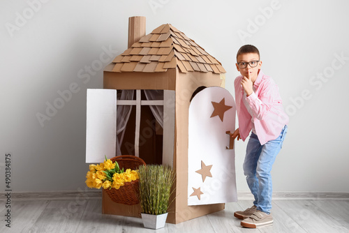 Funny little boy playing wi...