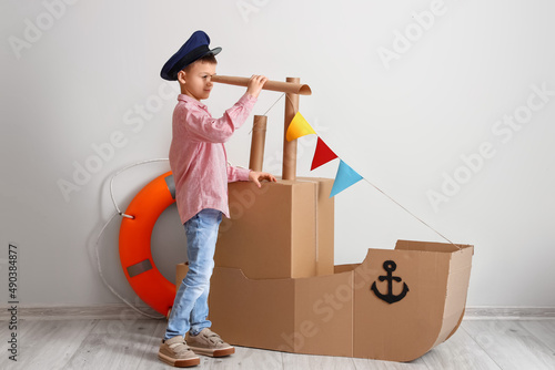 Funny little boy playing wi...