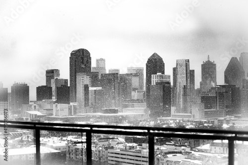 A Black and White Image of The Dallas Skyline During a Snow Storm  photo