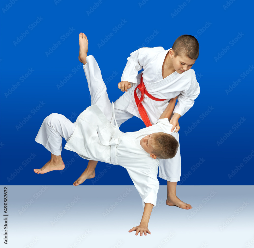 Two sportsmens are training judo throws Two sportsmens are training judo throws