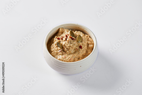 Ají de pepa is a traditional ecuadorian hot sauce made of squash seeds. It’s on a white background  photo