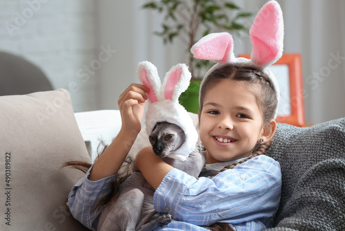Little girl and Sphynx cat ...
