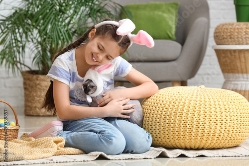 Little girl with Sphynx cat...