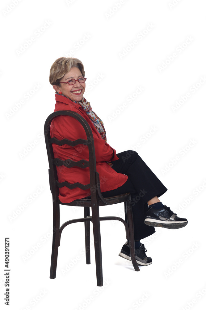 Fototapeta premium senior woman turning from a chair on white background