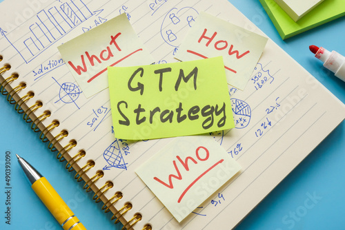 Notepad with marks and sticker GTM strategy.