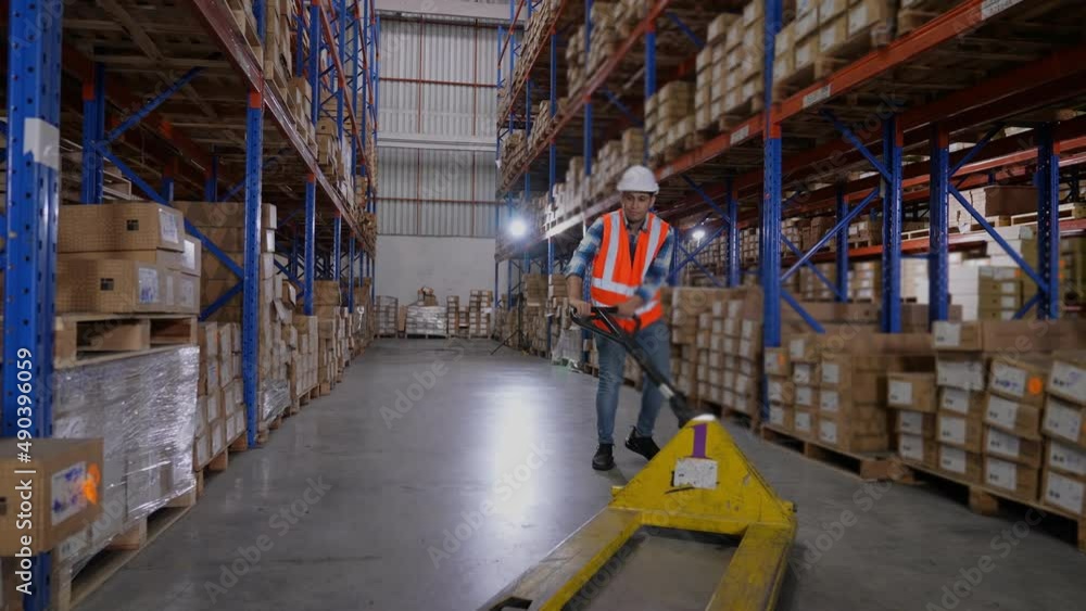 Business concept of 4k Resolution. Employees are moving goods inside the warehouse. Business concept of 4k Resolution. Employees are moving goods inside the warehouse.