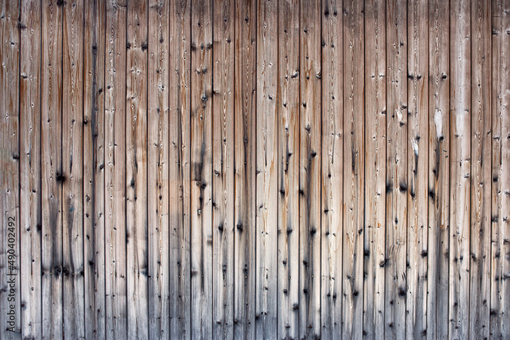 A brown wooden texture of a fence. A brown wooden texture of a fence.
