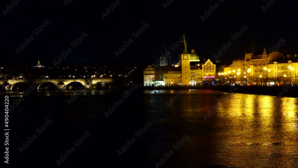 Embankment of Vltava River and bridge at night Embankment of Vltava River and bridge at night