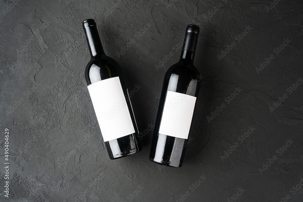 Bottle of Red Wine on a black background. Wine Bottle with Blank Label Mockup Bottle of Red Wine on a black background. Wine Bottle with Blank Label Mockup