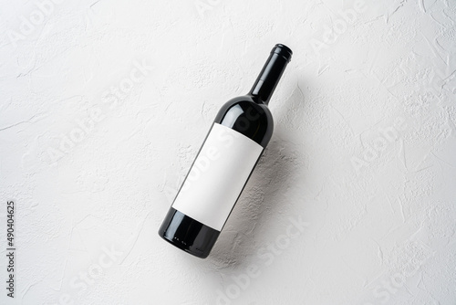 Bottle of Red Wine on a white background. Wine Bottle with Blank Label Mockup