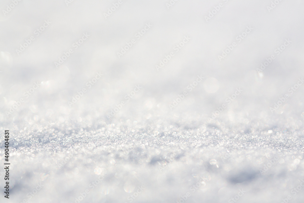 White snow close-up. Winter background with snow texture. Shallow depth of field and blur. Perfect for Christmas and New Year design. View with copy space. White snow close-up. Winter background with snow texture. Shallow depth of field and blur. Perfect for Christmas and New Year design. View with copy space.