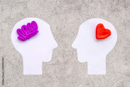 Brain and heart - logic and emotion. Communication between two paper human heads